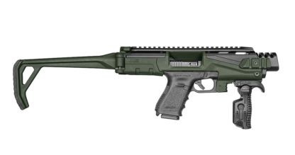 Konwersja Glock KPOS Scout FAB Zestaw Basic Green Konwersja Scout to połączenie mocnego aluminium lotniczego i lekkiego polimeru. Po umieszczeniu w nim pistoletu zmienia się w imponujący sprzęt taktyczny, do którego można przymocować rozmaite akcesoria - oświetlenie taktyczna, laser i inne. Kompatybilna z Glockami 17, 19, 22, 23, 25, 31, 32 / Gen 3 - - LifeGun.pl Konwersja Glock KPOS Scout FAB Zestaw Basic Green-1