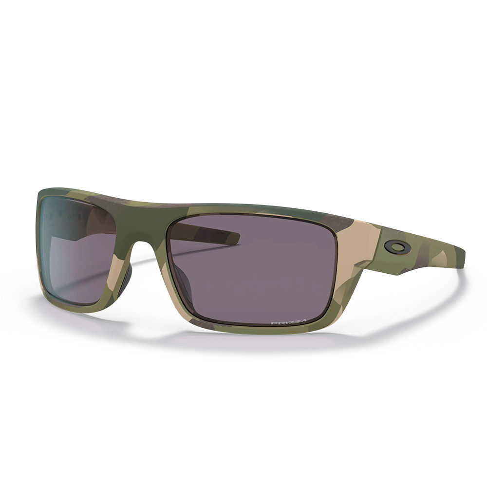 Drop Point™ renomowanej firmy Oakley to okulary ochronne z oprawką w kamuflażu MultiCam® oraz przyciemnianymi szkłami Grey. Stanowią one doskonałe połączeniem najwyższej jakości ochrony oczu z rozpoznawalnym i sprawdzonym wzornictwem spod znaku Oakley. Lekki i wytrzymały materiał ramy O Matter® oferuje komfort najwyższej jakości. Technologia Oakley Three-Point Fit maksymalizuje komfort użytkowania, jednocześnie utrzymując soczewki w - LifeGun.pl Oakley - Okulary ochronne SI Drop Point MultiCam® - Prizm Grey - OO9367-2860-1